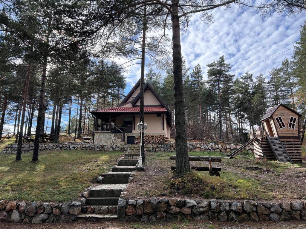 a small house in the middle of a forest at Vikendica Martinović in Divčibare
