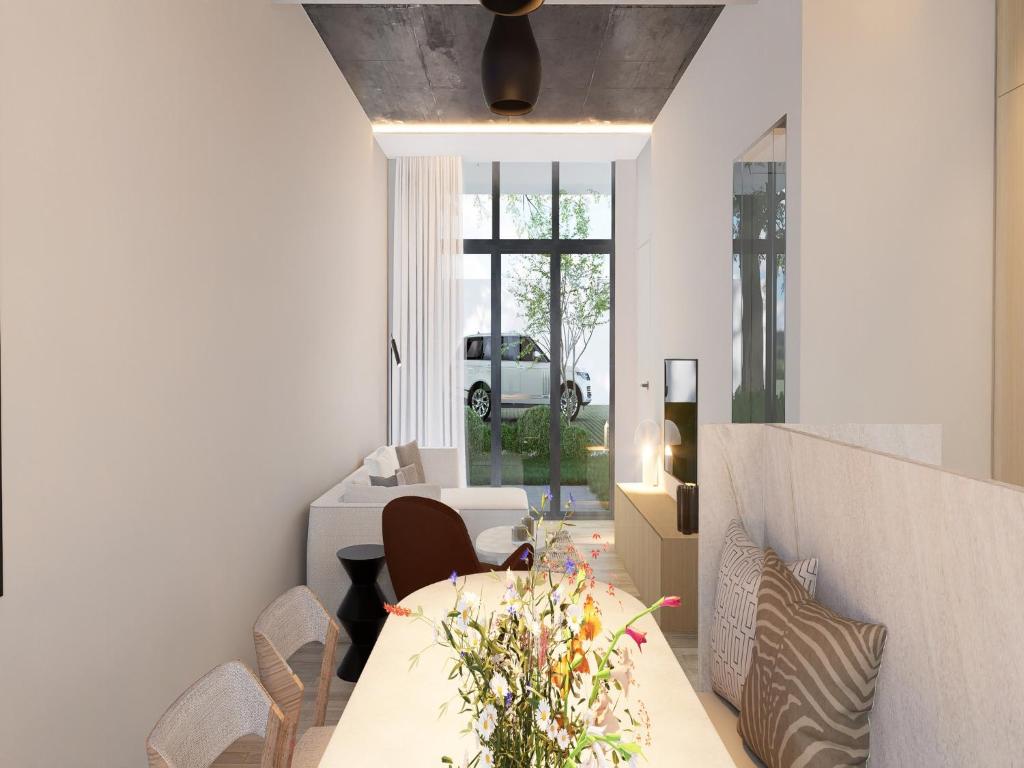 a dining room with a table and chairs at Spacious 3-Floor Holiday Home for 8 Guests in Bree