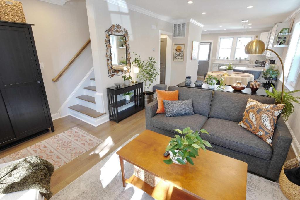 a living room with a couch and a table at The Brightwood House - Family Living in the Heart of DC in Washington