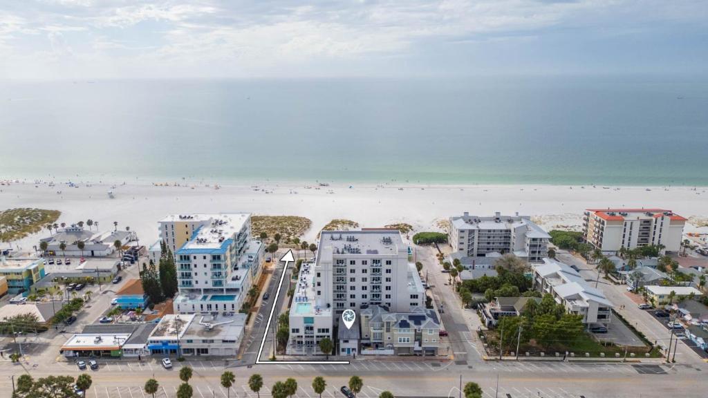 an aerial view of a beach with buildings and condos at Clearwater Bliss Apartment 3 in Clearwater Beach