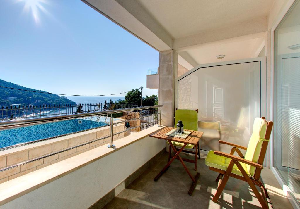 a balcony with a view of a swimming pool at Villa Katarina Studio Apartments in Dubrovnik
