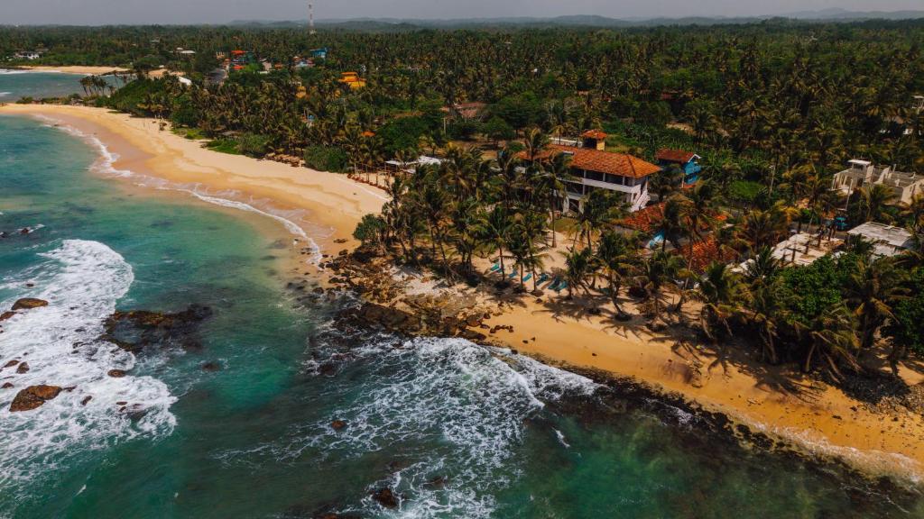 an aerial view of a beach and the ocean at Surfescape Sri Lanka in Midigama East