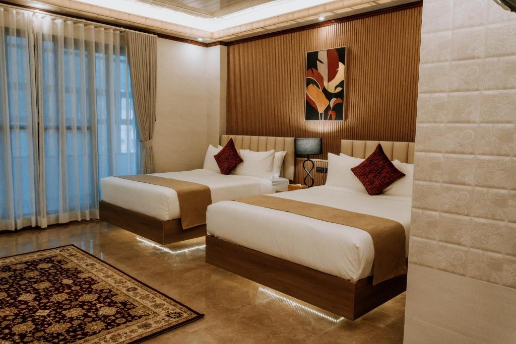 Postel nebo postele na pokoji v ubytování Rosepine Hotel