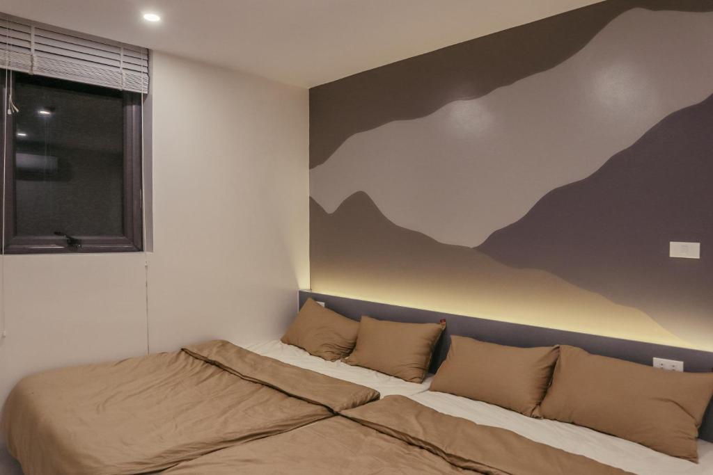 Ένα ή περισσότερα κρεβάτια σε δωμάτιο στο Flâner Home