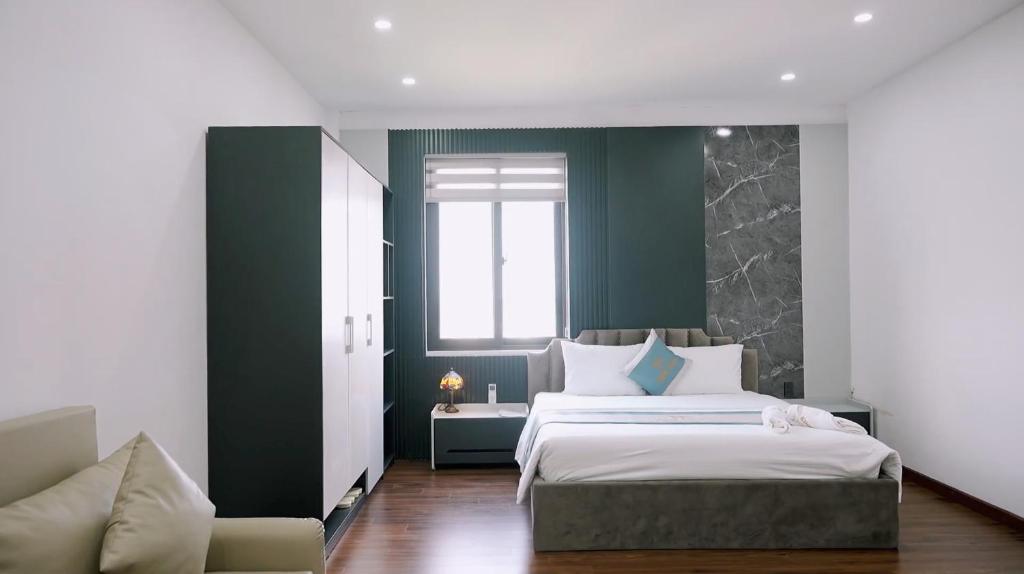 Ένα ή περισσότερα κρεβάτια σε δωμάτιο στο Winner Hotel