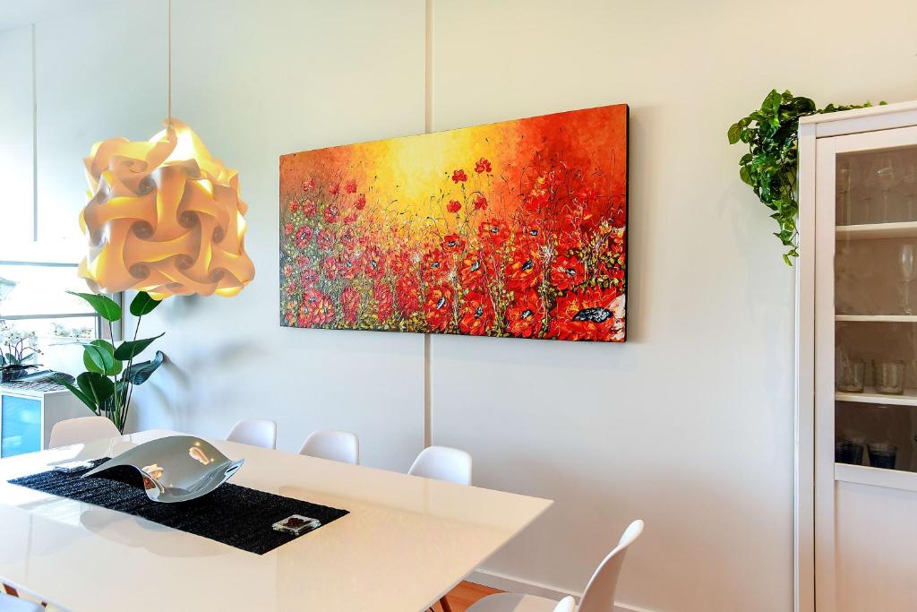 a painting hanging on a wall in a room at 4A Wood St-PetsNegotiable Linen Included Wi-Fi - Linen Included in Kilki