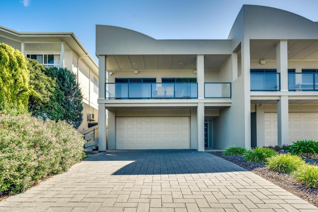 an apartment building with a driveway in front of it at Bluffview B&B - Luxury Oceanviews - Wi-Fi - No Linen Included in McCracken