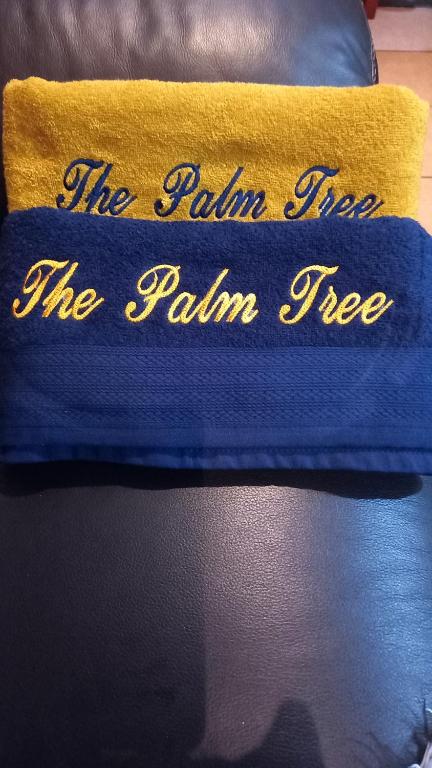 a pillow that says the rain tree the palm tree at The Palm Tree in Saldanha