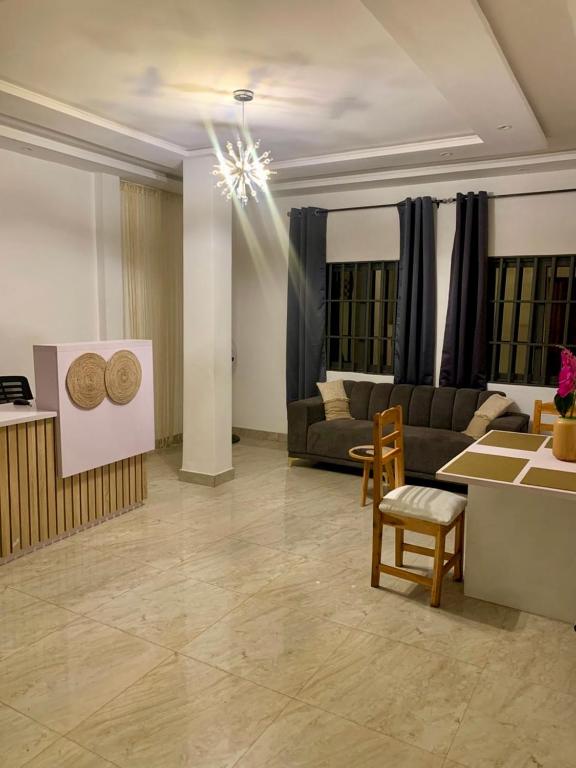a living room with a couch and a table at Luxo in Cotonou