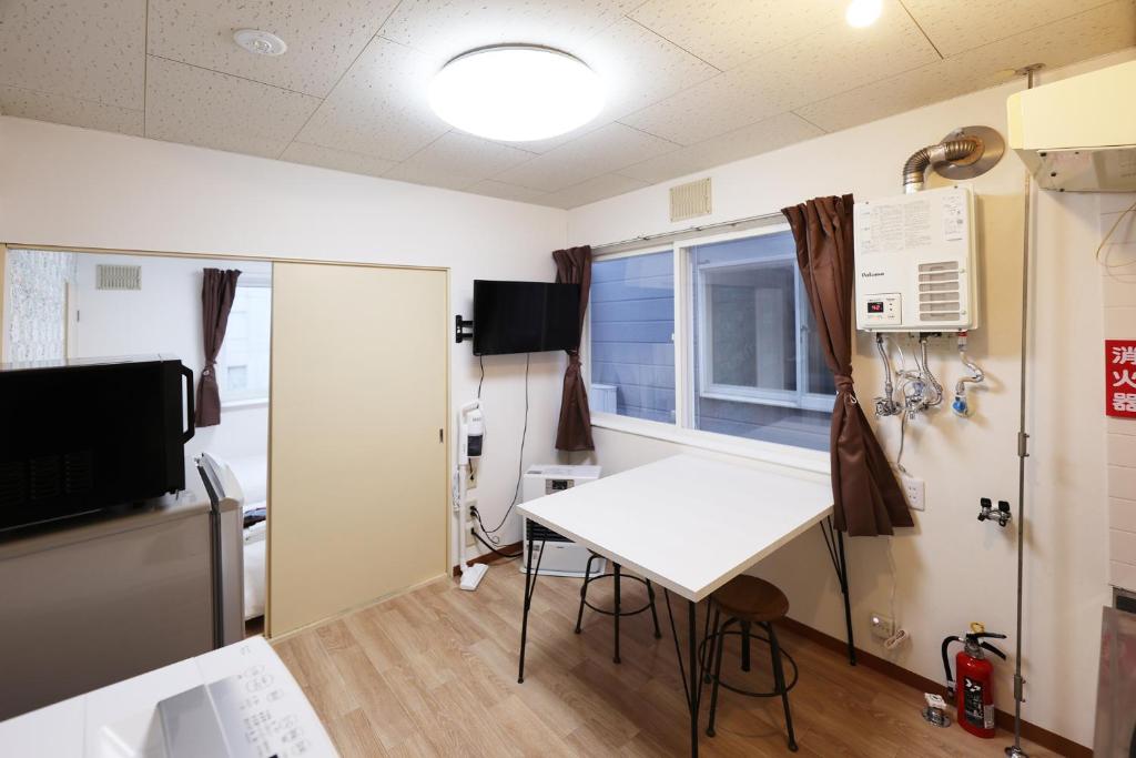 Μια τηλεόραση ή/και κέντρο ψυχαγωγίας στο Vivere103ー札幌市地下鉄南平岸駅徒歩3分ーS-beds2