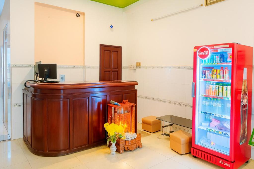 a courtroom with a podium and a red refrigerator at Ly Ly Hotel in Ho Chi Minh City