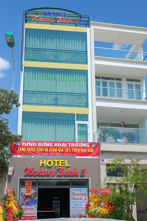a building with signs in front of a hotel at Hoàng Bách 3 Hotel in Ho Chi Minh City
