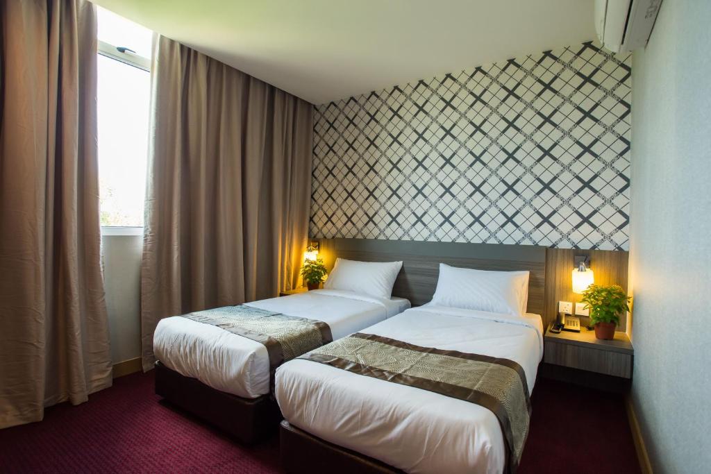 Postel nebo postele na pokoji v ubytování LS Hotel