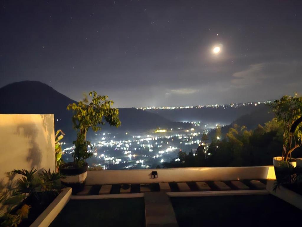 a view of a city lit up at night at Pinggan Chill Out Kintamani in Gretek