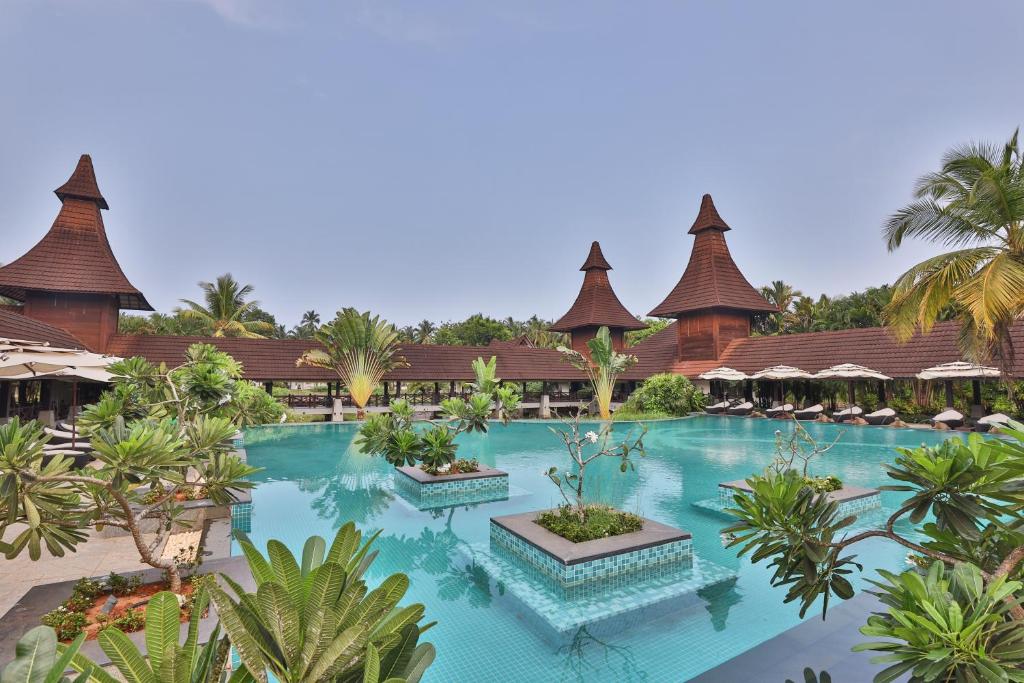 an aerial view of a resort with a swimming pool at The Lalit Resort & Spa Bekal in Bekal