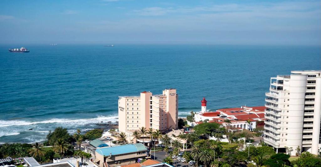an aerial view of a city and the ocean at Beachfront Suite Ocean-View Balcony 300Mb Fibre in Durban