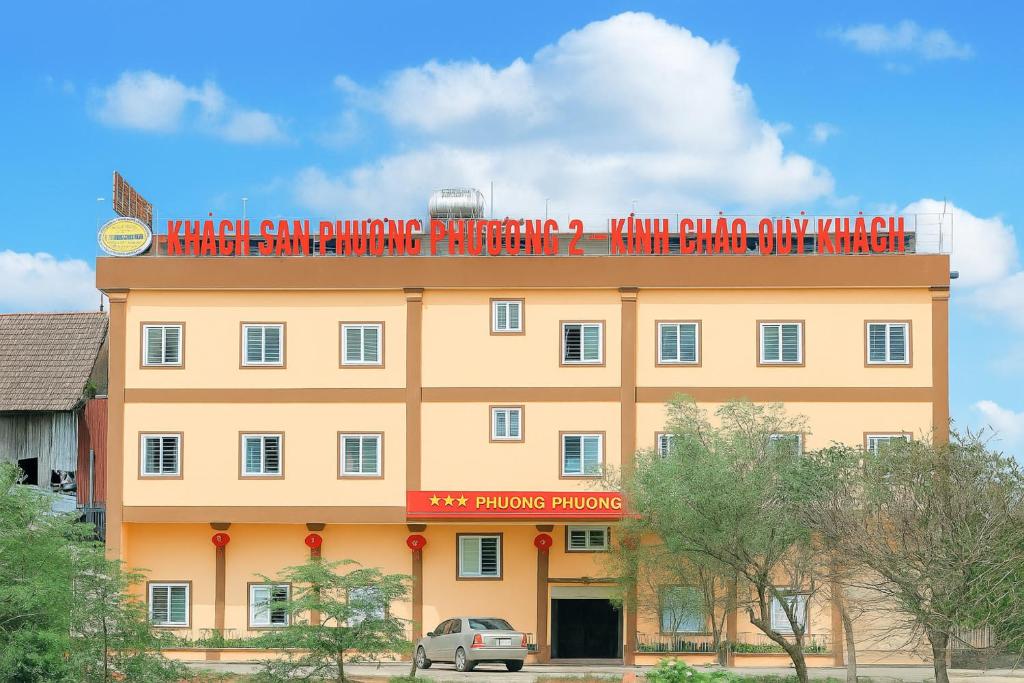 a building with a sign on the top of it at Phương Phương 2 Hotel in Ha Tinh
