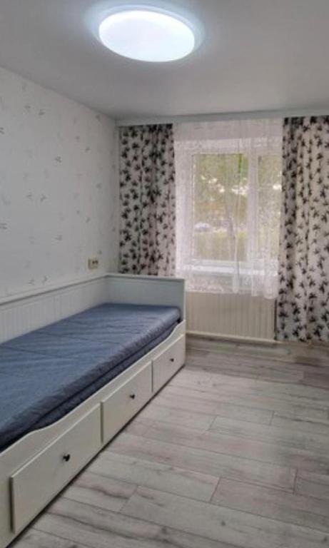 Postel nebo postele na pokoji v ubytování Pas Dianą 1 aukštas