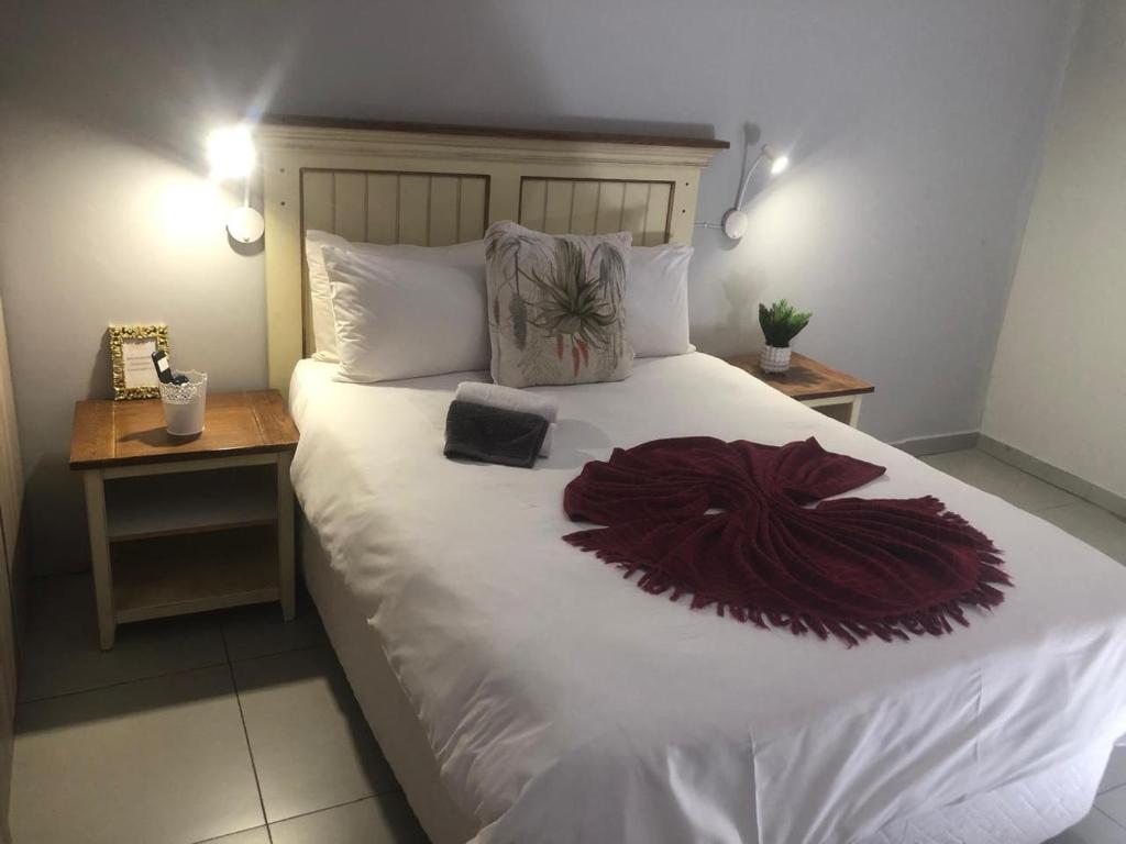 Ένα ή περισσότερα κρεβάτια σε δωμάτιο στο Divine Guest Lodge