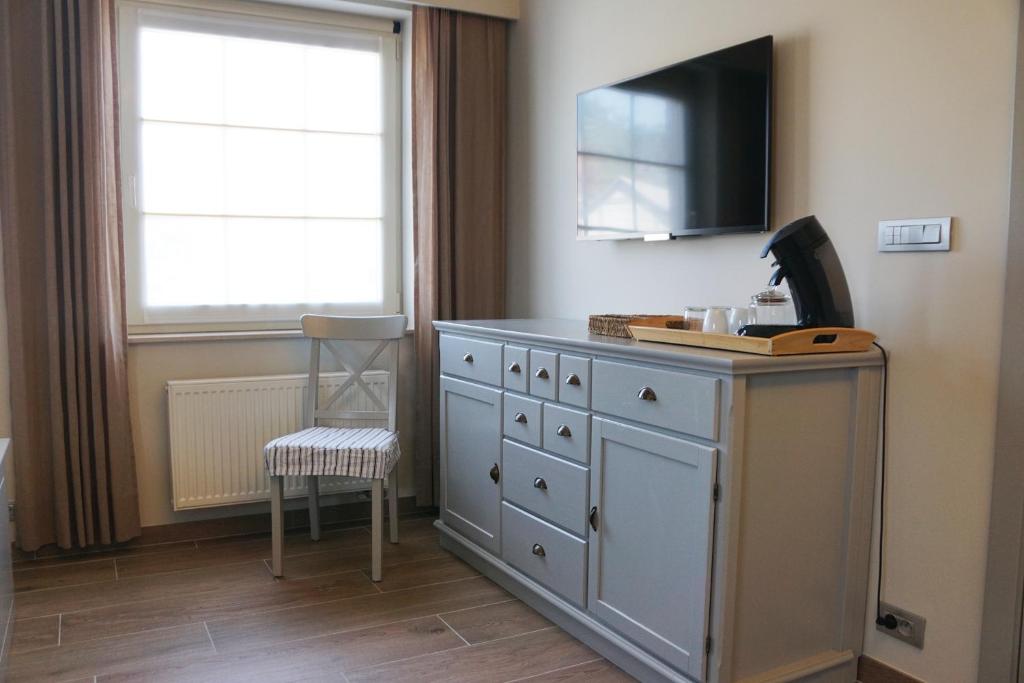 TV a/nebo společenská místnost v ubytování B&B The Beachhouse