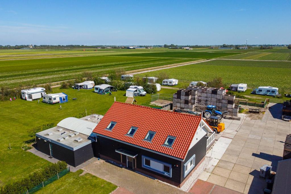 an aerial view of a house with a red roof at New! Guesthouse Eindeloos in 't Zand