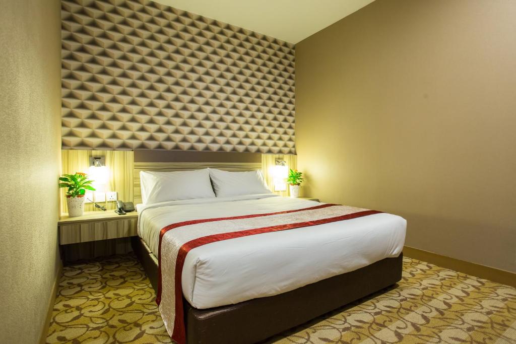 Postel nebo postele na pokoji v ubytování LS Hotel