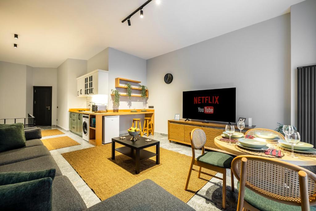 a living room with a couch and a table at Respiro Rooms in Istanbul