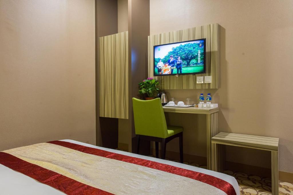 Postel nebo postele na pokoji v ubytování LS Hotel