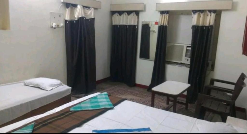 Ένα ή περισσότερα κρεβάτια σε δωμάτιο στο International Guest House