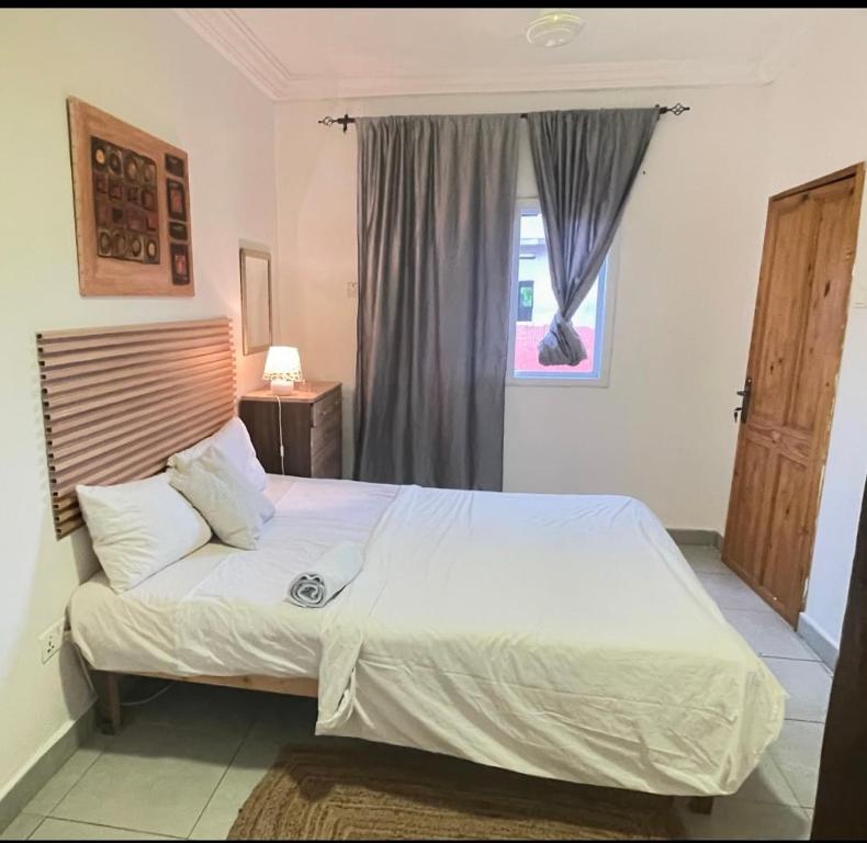 Ένα ή περισσότερα κρεβάτια σε δωμάτιο στο Cozy Apartment