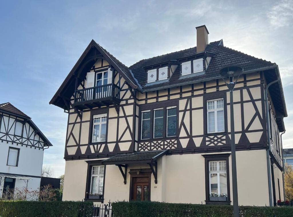 an old house with a black and white at Strasbourg Tivoli in Strasbourg