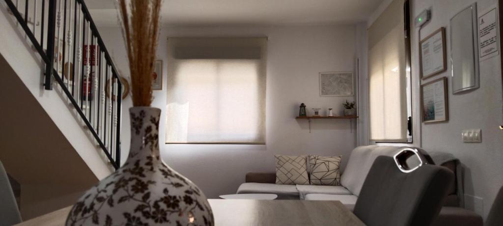 a vase sitting on a table in a living room at Casa de la Aldea in Guarros