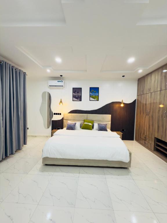 Ένα ή περισσότερα κρεβάτια σε δωμάτιο στο Merakie Homes