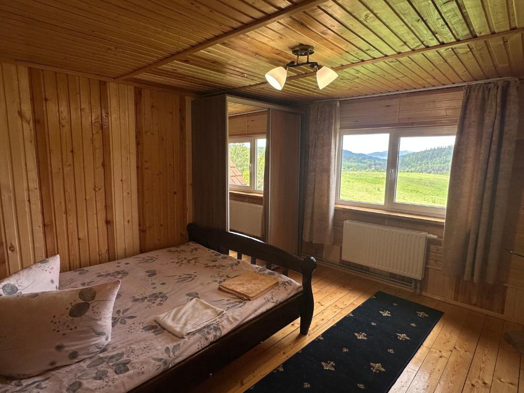 Ένα ή περισσότερα κρεβάτια σε δωμάτιο στο Лісовий Затишок