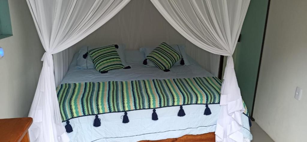 Postel nebo postele na pokoji v ubytování SuÍte MAR Espaço Kombucha Para-ty