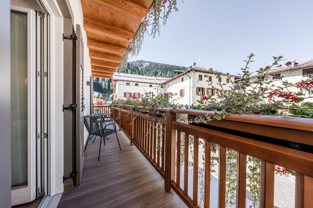 a balcony with a view of a city at Casa Slucca in Pellizzano