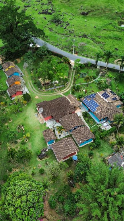 an overhead view of a group of houses with solar panels at Pousada Sítio Val Paraíso in Sana