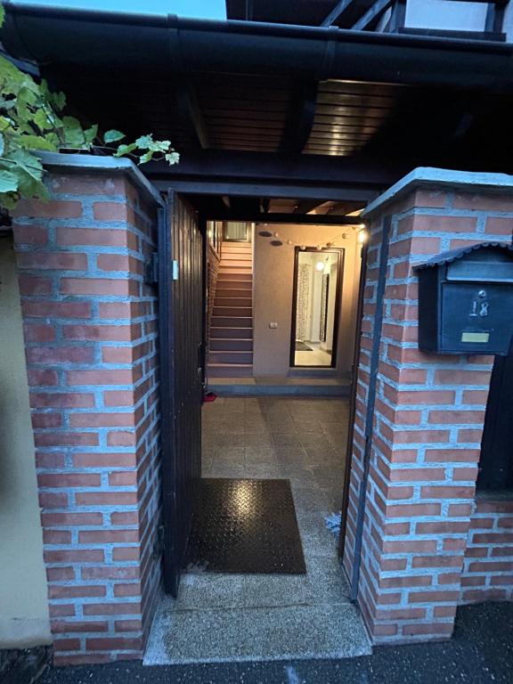 an entrance to a brick building with a mailbox at Villa Apartments in Craiova