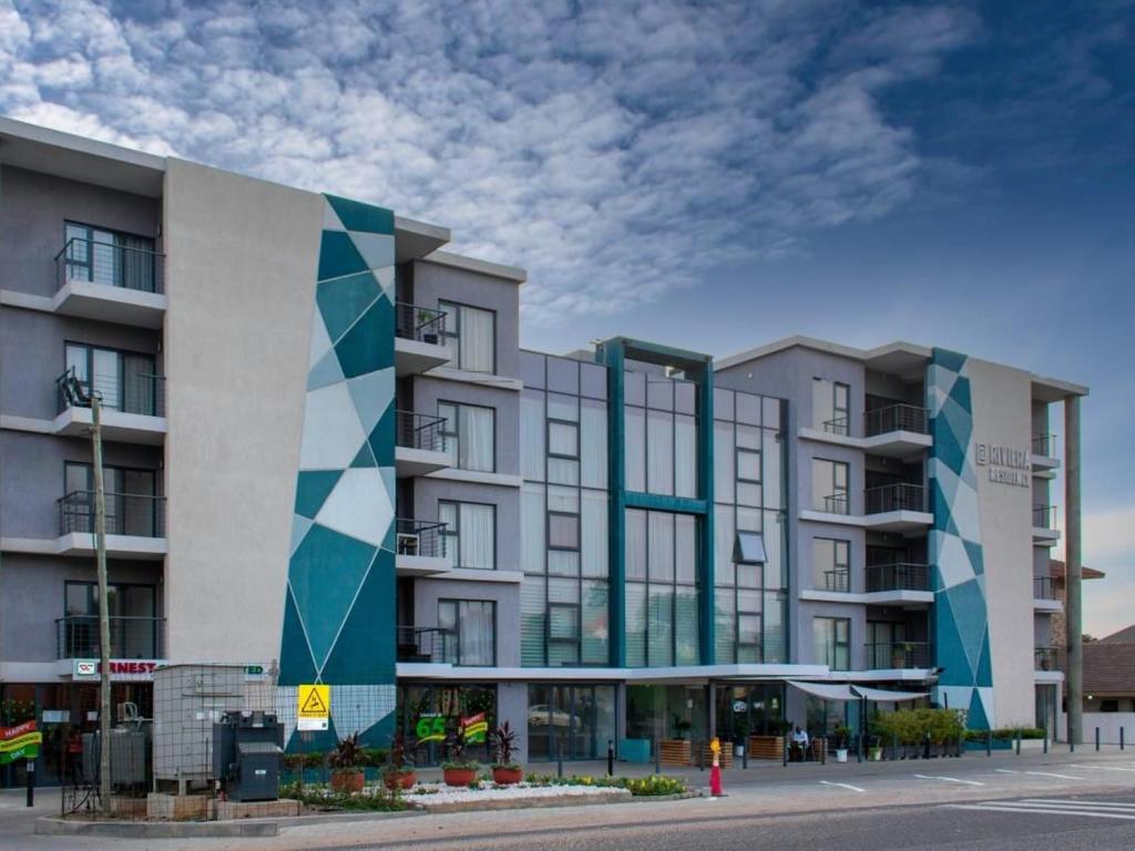 eine Darstellung eines Gebäudes in einer Straße in der Unterkunft Uban Oasis in Accra