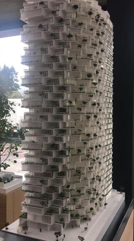 a tall stack of books on a wall at B&B KELLY Ecuador in Quito