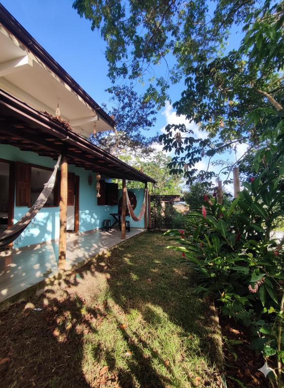 a person standing on the porch of a house at Loft Vista Mar in Itacaré