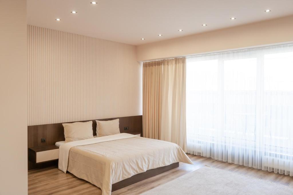 Ένα ή περισσότερα κρεβάτια σε δωμάτιο στο Garden plaza