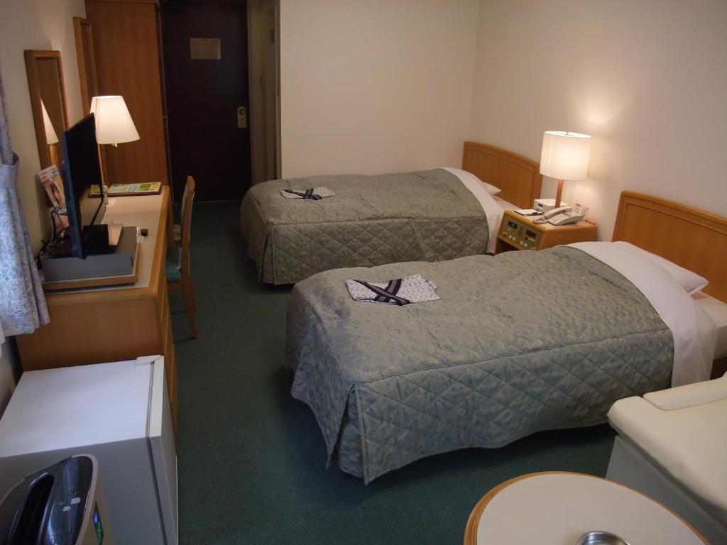 Postel nebo postele na pokoji v ubytování Hotel Tateshina