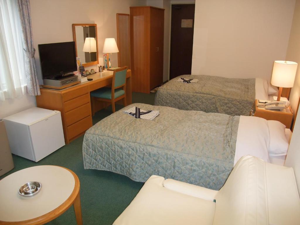 Postel nebo postele na pokoji v ubytování Hotel Tateshina