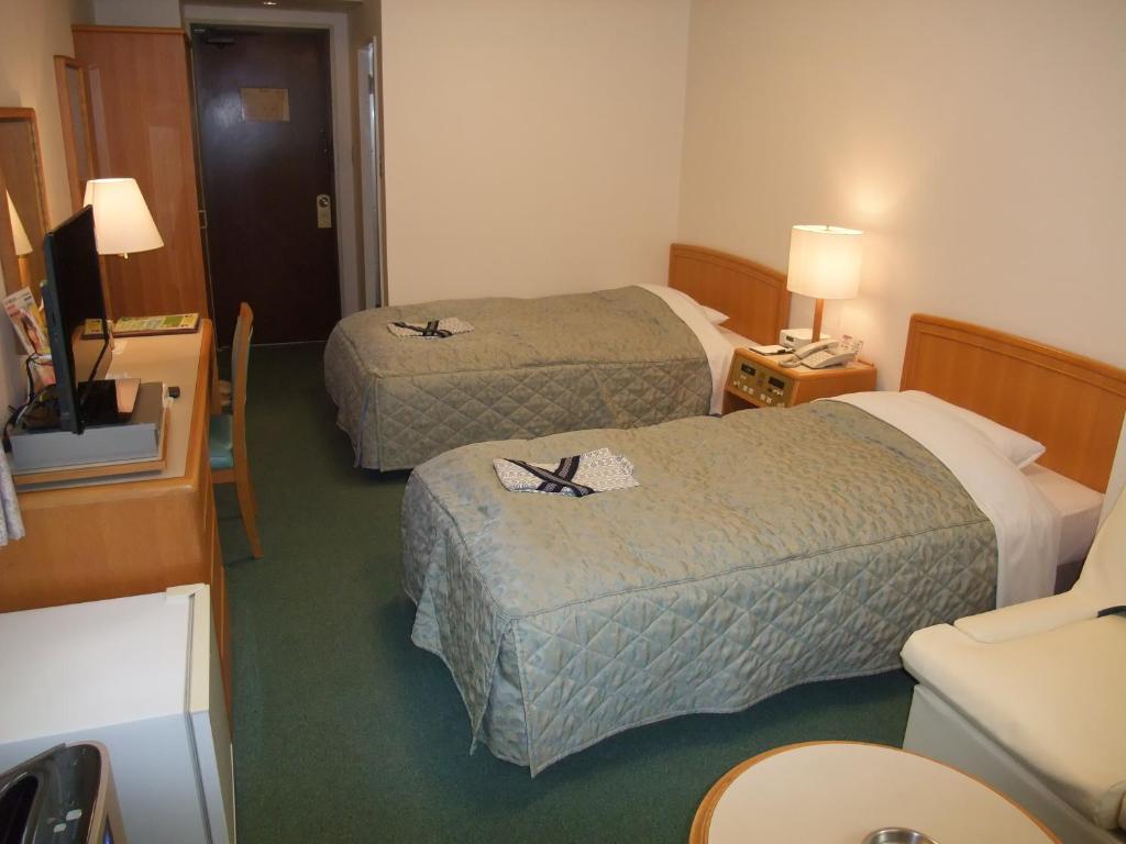 Postel nebo postele na pokoji v ubytování Hotel Tateshina