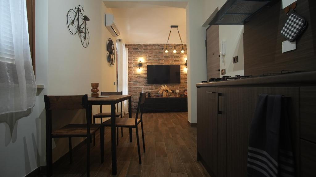 a kitchen and dining room with a table and chairs at Terminal7-Skyline in Ciampino