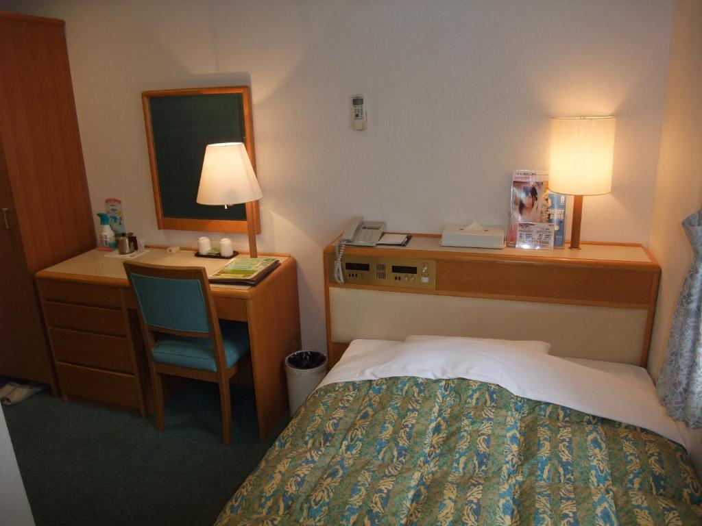 Postel nebo postele na pokoji v ubytování Hotel Tateshina