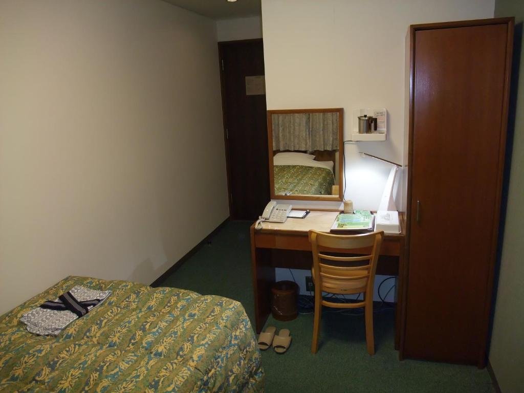 Postel nebo postele na pokoji v ubytování Hotel Tateshina