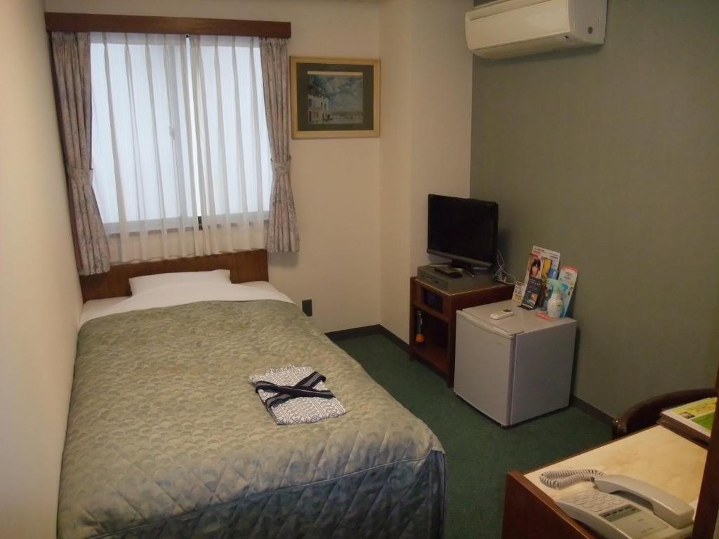 Postel nebo postele na pokoji v ubytování Hotel Tateshina