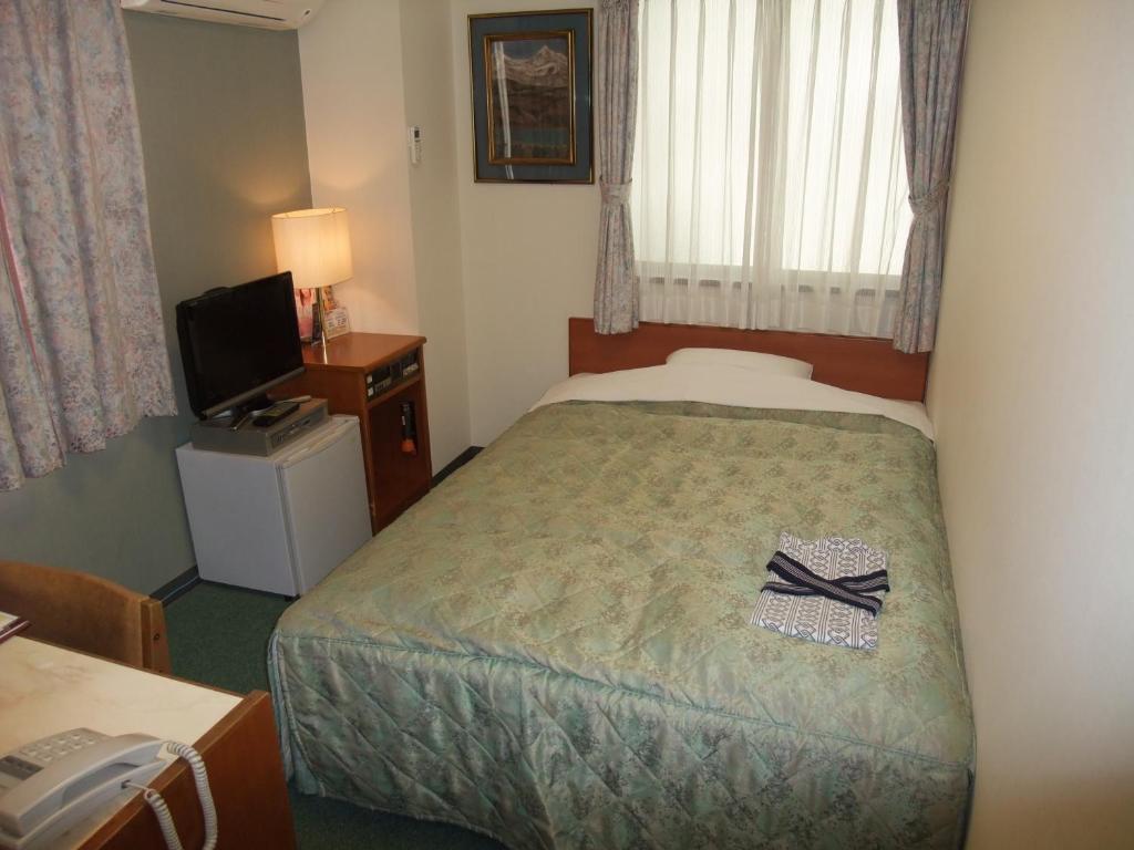Postel nebo postele na pokoji v ubytování Hotel Tateshina
